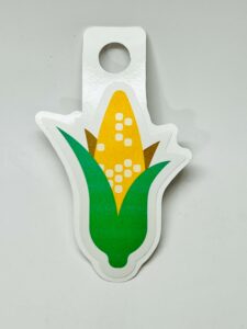 Sticker featuring a colorful ear of corn